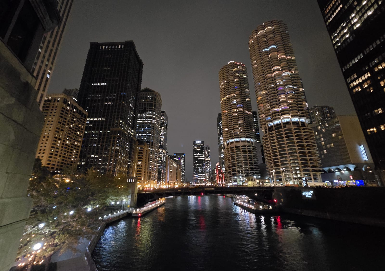 The twin corncob towers of Marina City above the Chicago River and a bascule bridge at night